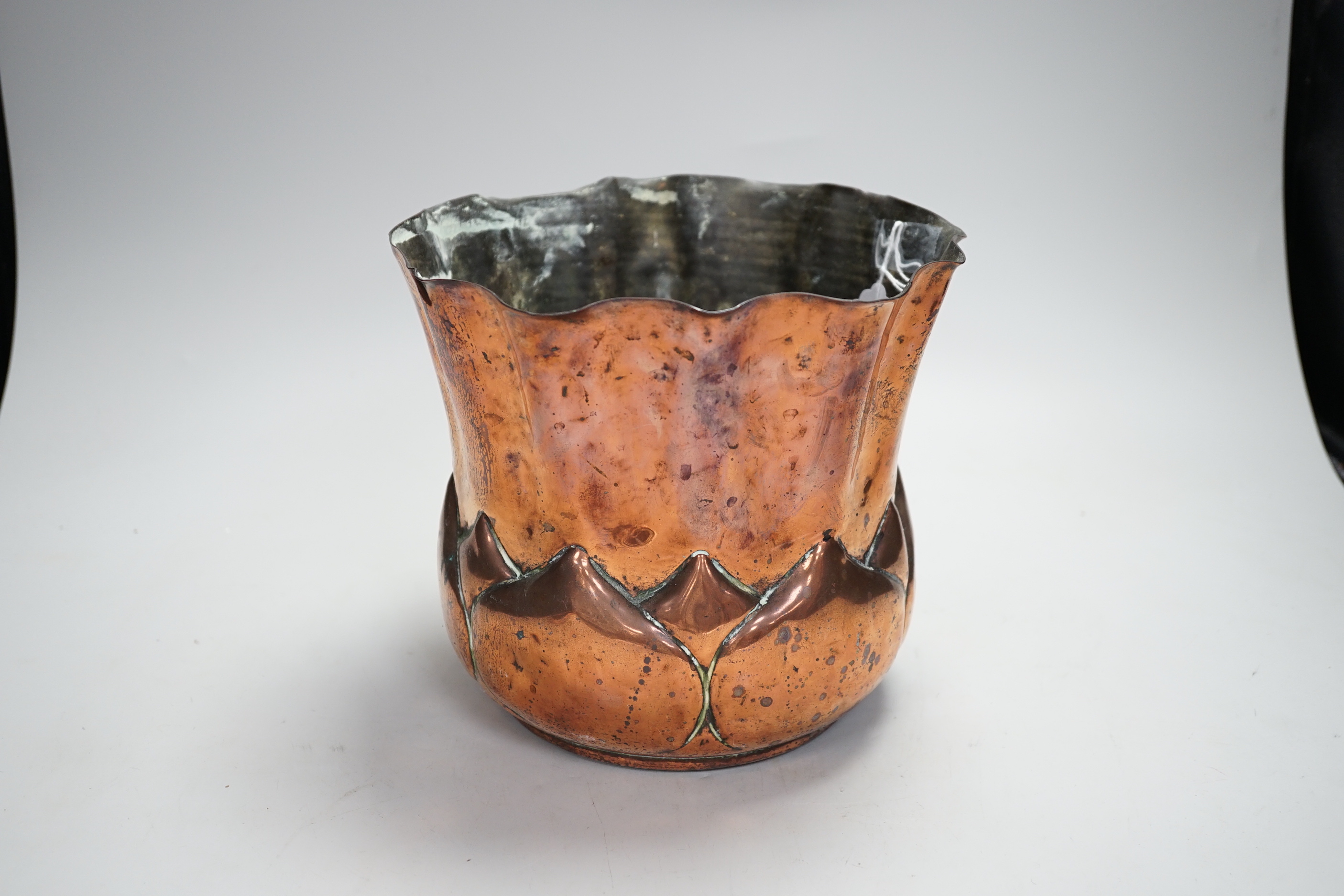 A W.A.S. Benson Arts and Crafts embossed copper jardiniere, impressed mark to the base, 19cm high